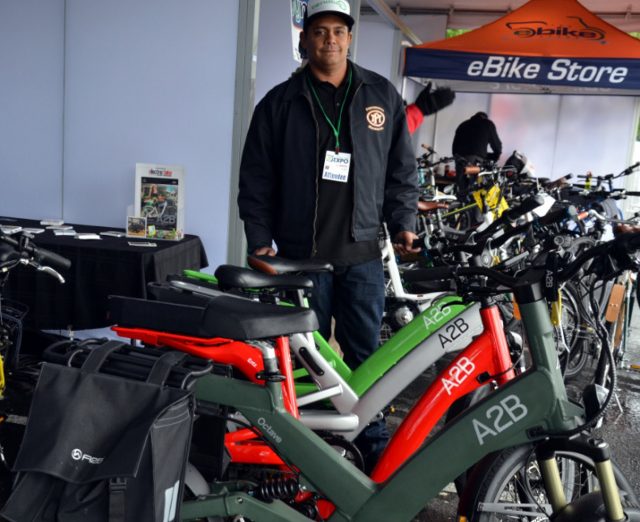 Keola Munos with A2B's heavy-duty lineup.(Photos: M.Andersen/BikePortland)