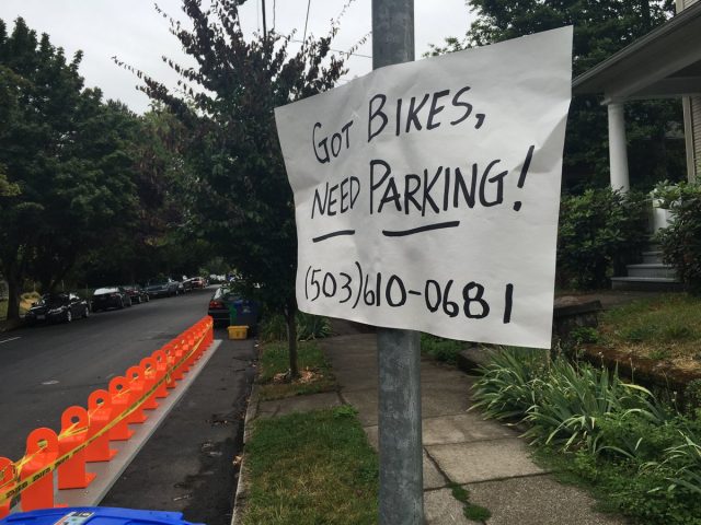 Image of residential Biketown station posted to Twitter by @twjpdx23. (The number is the city's Biketown hotline).