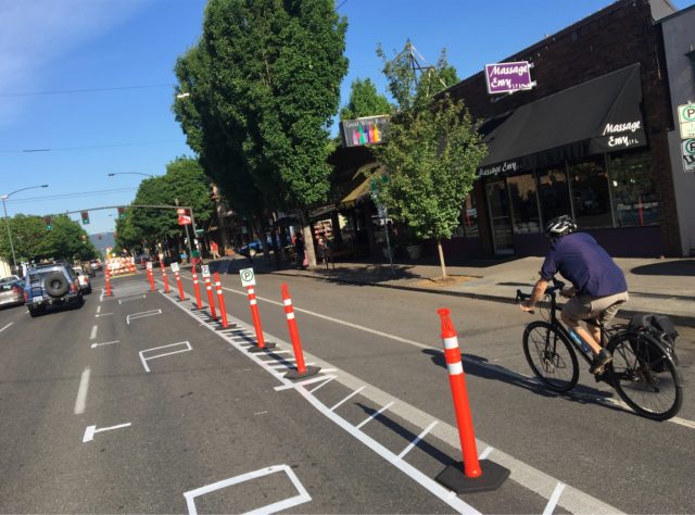 Volunteers have condensed the project and now the entire thing has a functioning parking-protected bikeway.