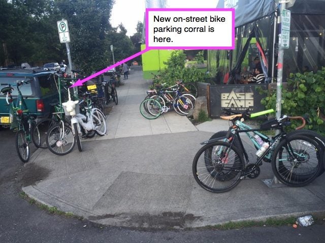 The new bike parking opens up space on the sidewalk and the street — providing safety for everyone and security for bike owners.(Photo by Ross Putnam)