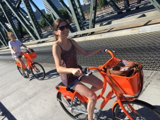 Biketown users on the Hawthorne Bridge yesterday.(Photos: J. Maus/BikePortland)