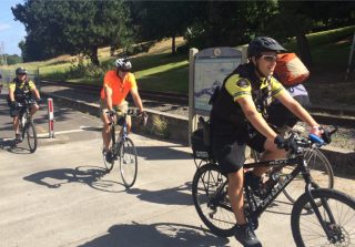 Officers Dave Sanders (right) and Ben Labasan on the Springwater Path Saturday.(Photos: Portland Police Bureau)