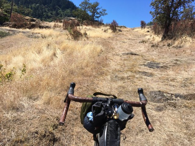 Hard to capture in an image, but the tamped down section of road on the right is the Applegate Trail.