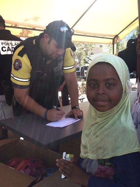 police-Ofc_Green_signing_participation_card_girl.msg