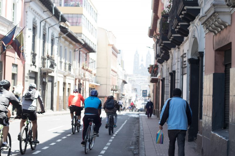 Ciclopaseo through Old Quito with Basílica del Voto Nacional in the background.