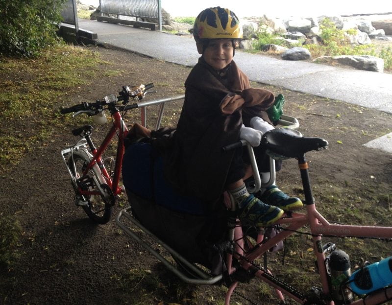 Picnic blanket cape to the rescue in an unexpected downpour.