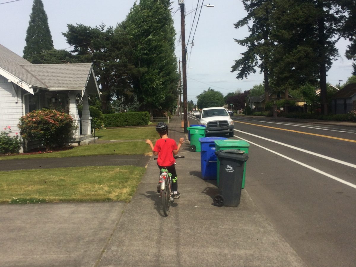 riding bike on sidewalk