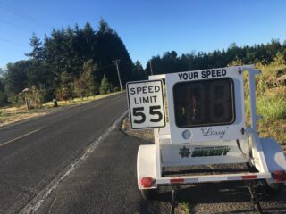 a speed reader tool at side of rural road