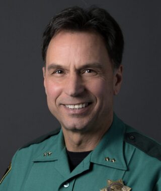 head shot of man in a police uniform.