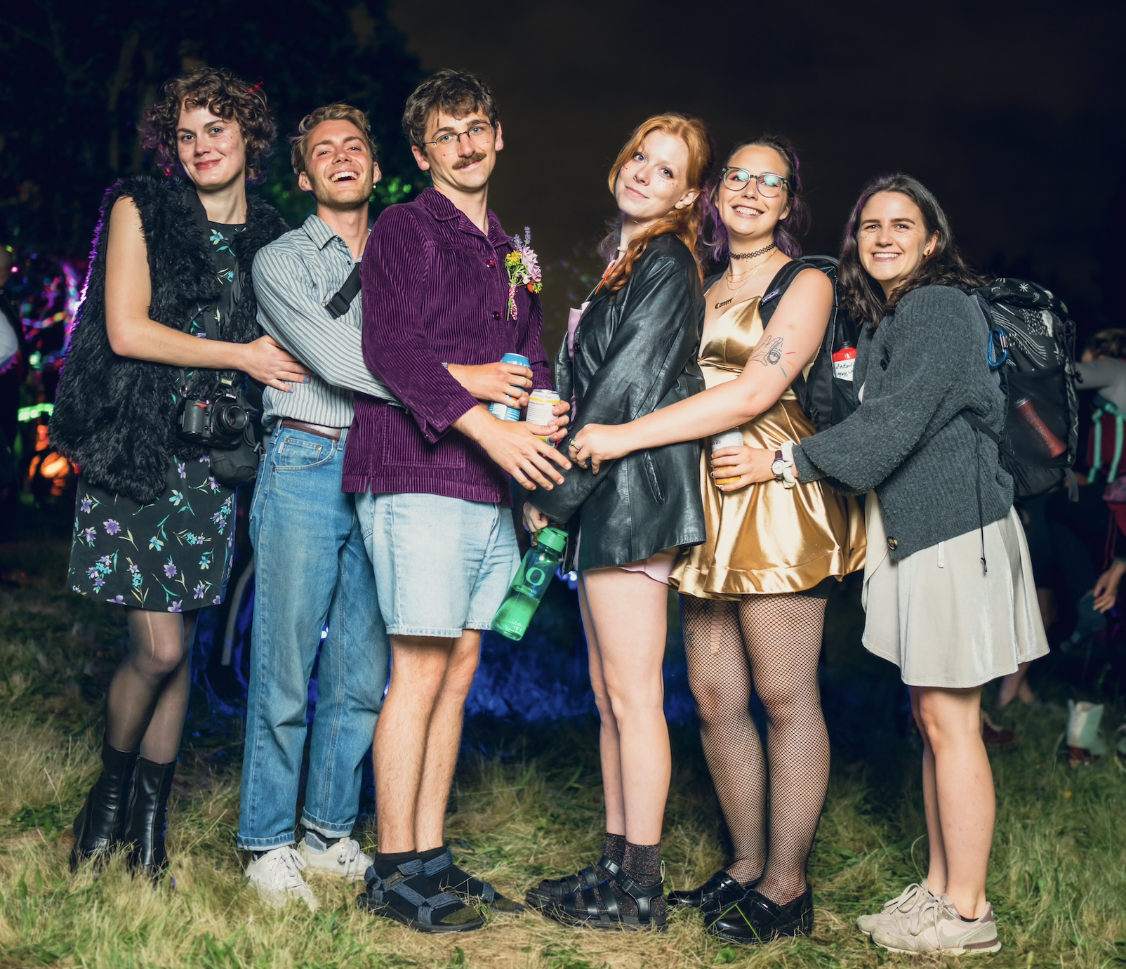 Six people posing together in prom style shot.