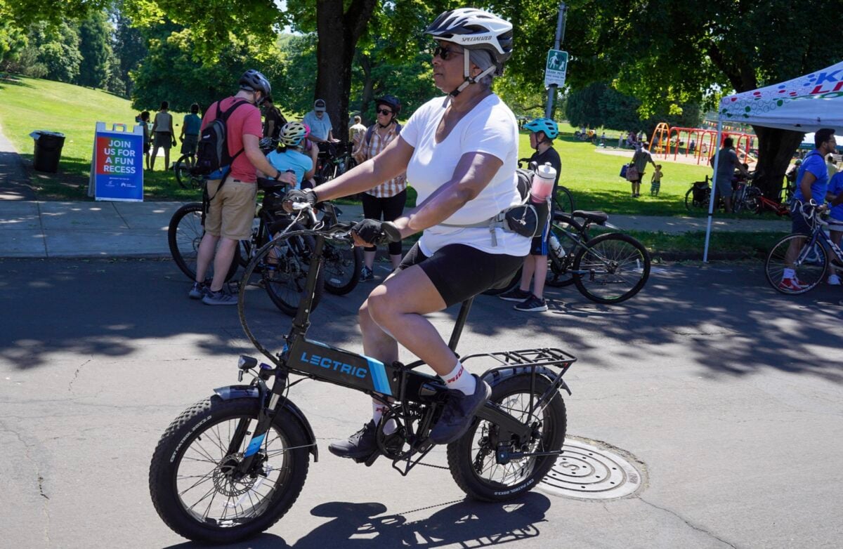 person riding an electric bike on a street